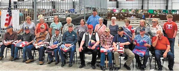 Local quilt guild presents handmade quilts to area veterans