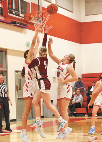 Lady Wolves split road games